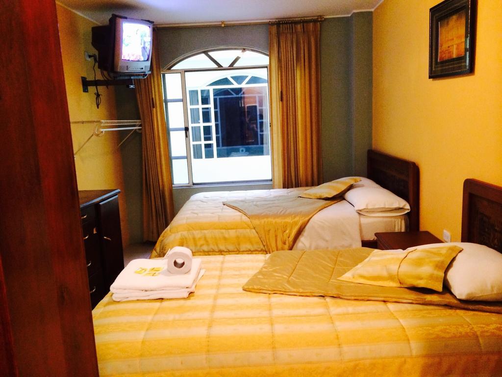 Hostal Grand Rio Baños Habitación foto